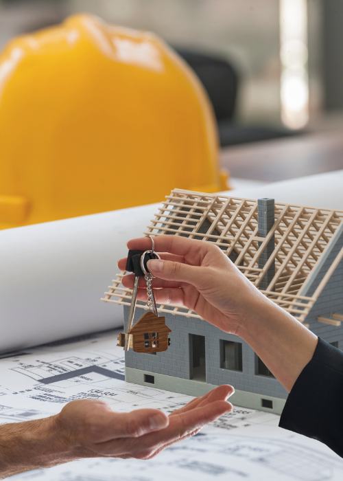 Experienced builder overseeing residential construction project with skilled workers on site.